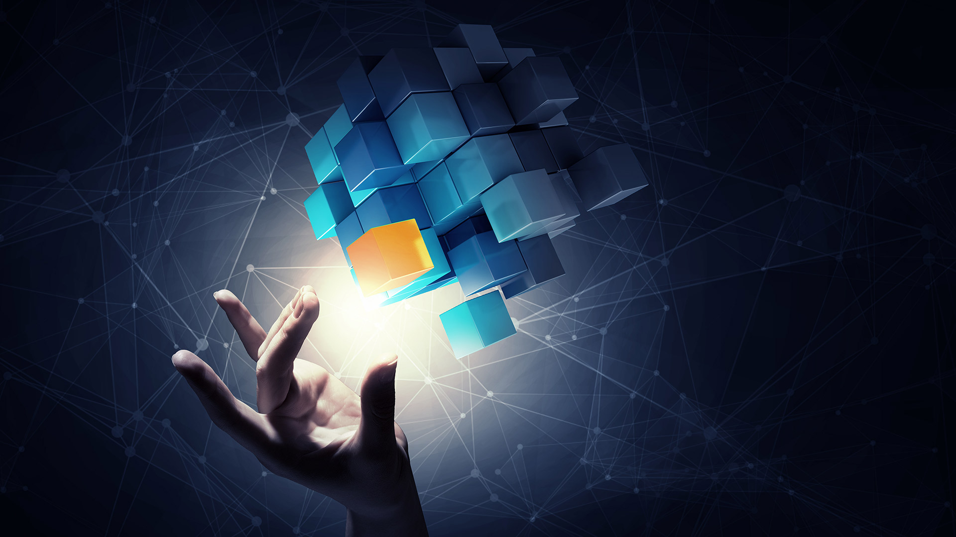 Business person selecting cube