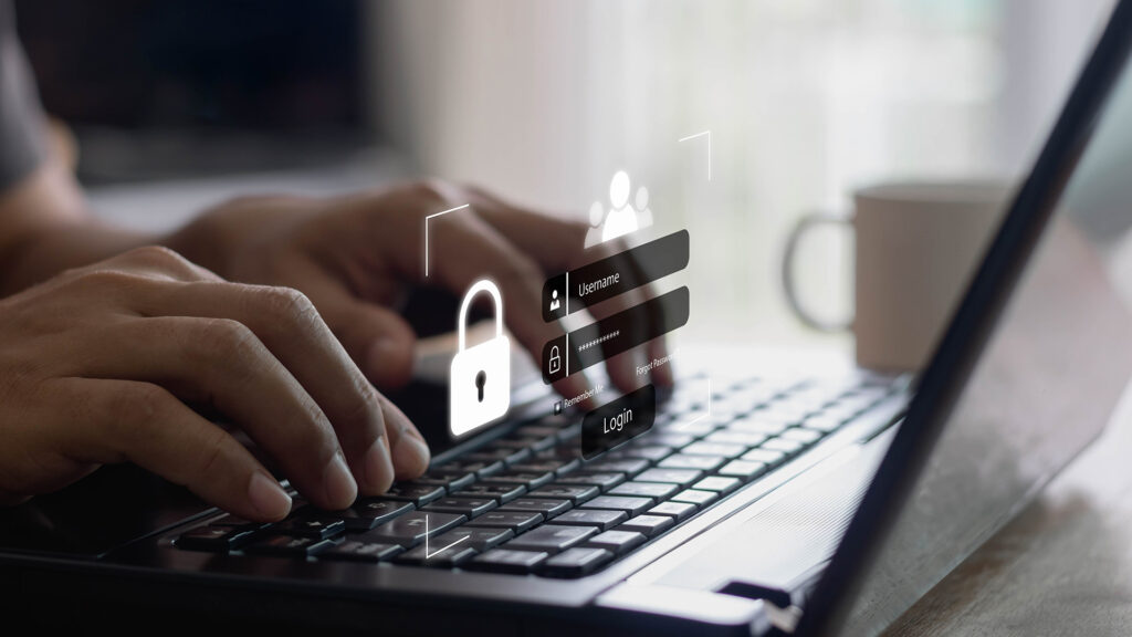 Person using laptop with protection pop-up.